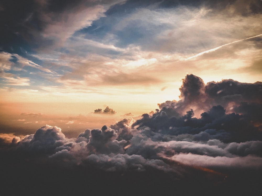 nimbus clouds under golden hour wallpaper