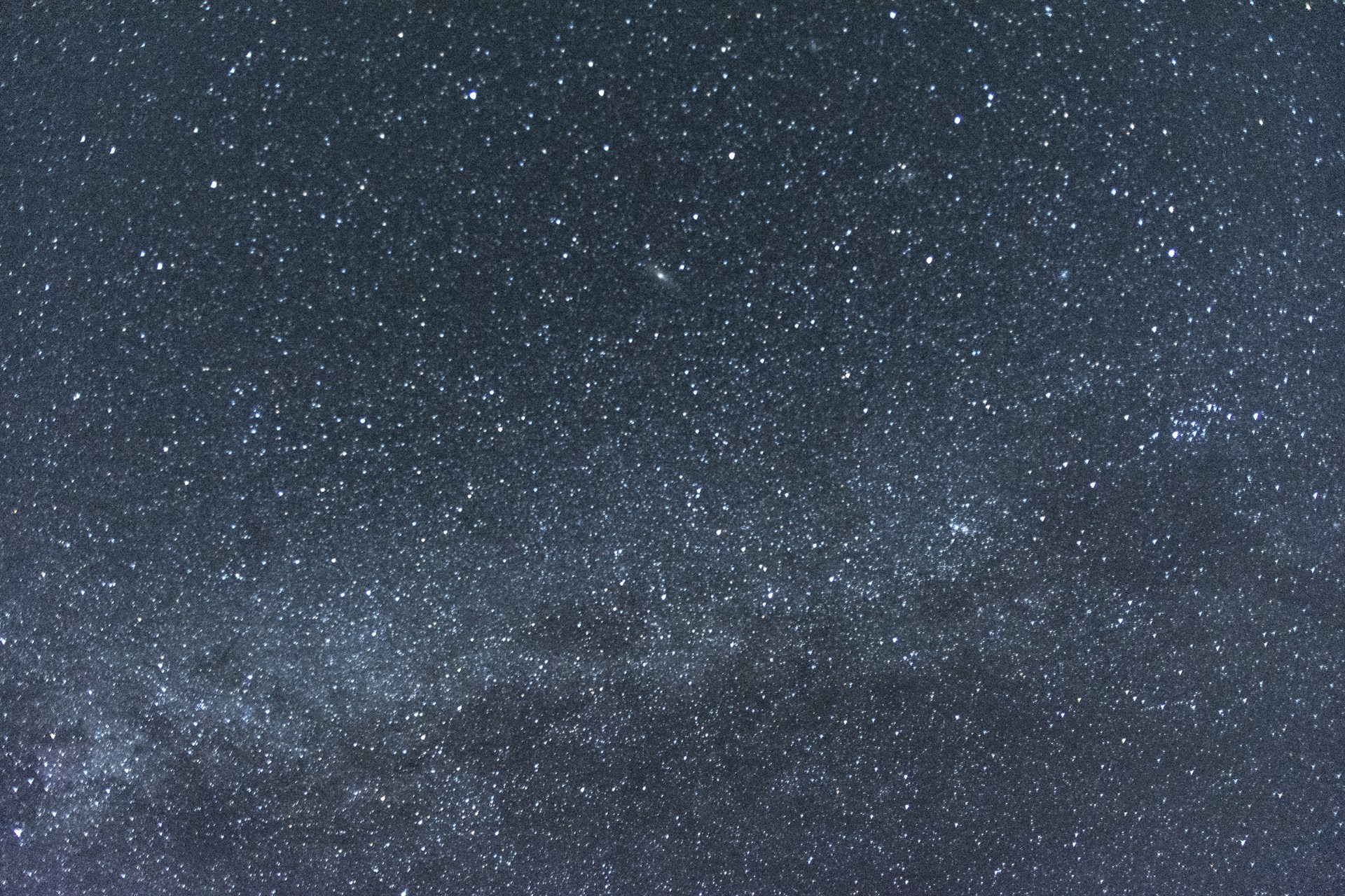 woman wearing yellow long-sleeved dress under white clouds and blue sky during daytime