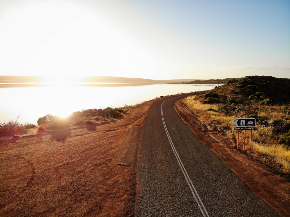 black asphalt road during sunrise