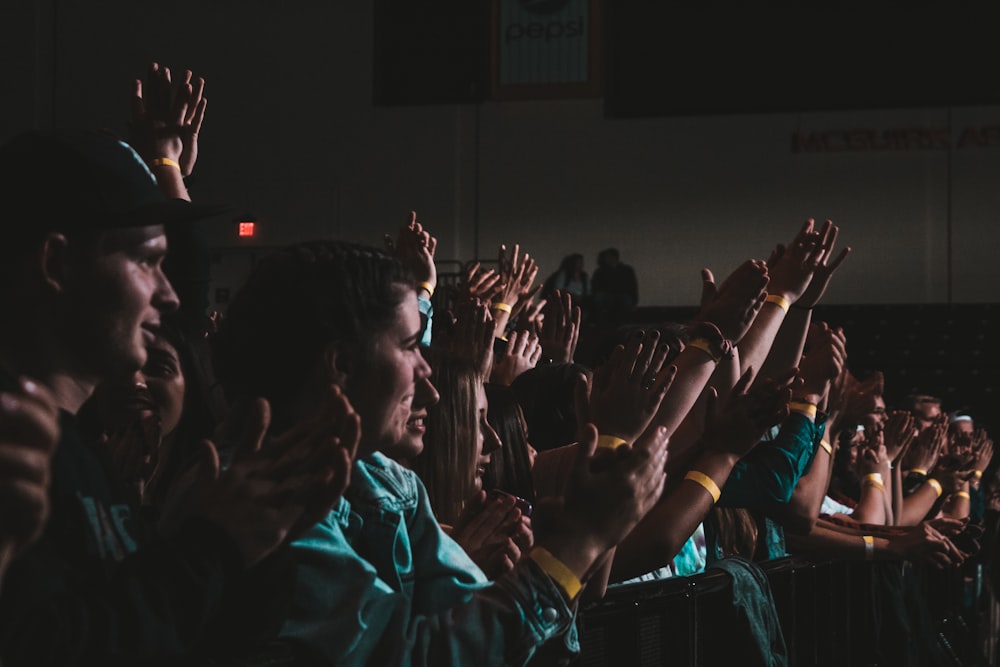 group of people clapping hands