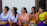 A group of women sitting together, sharing stories in a rural Bangladeshi setting.