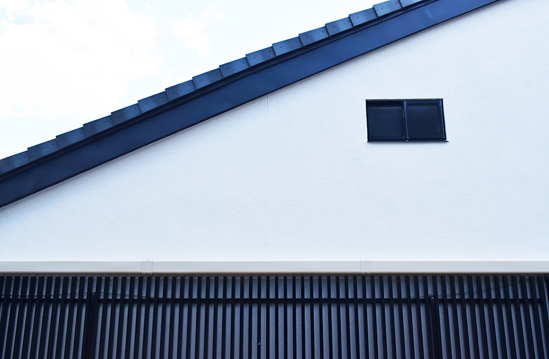 white and black concrete house close-up photography