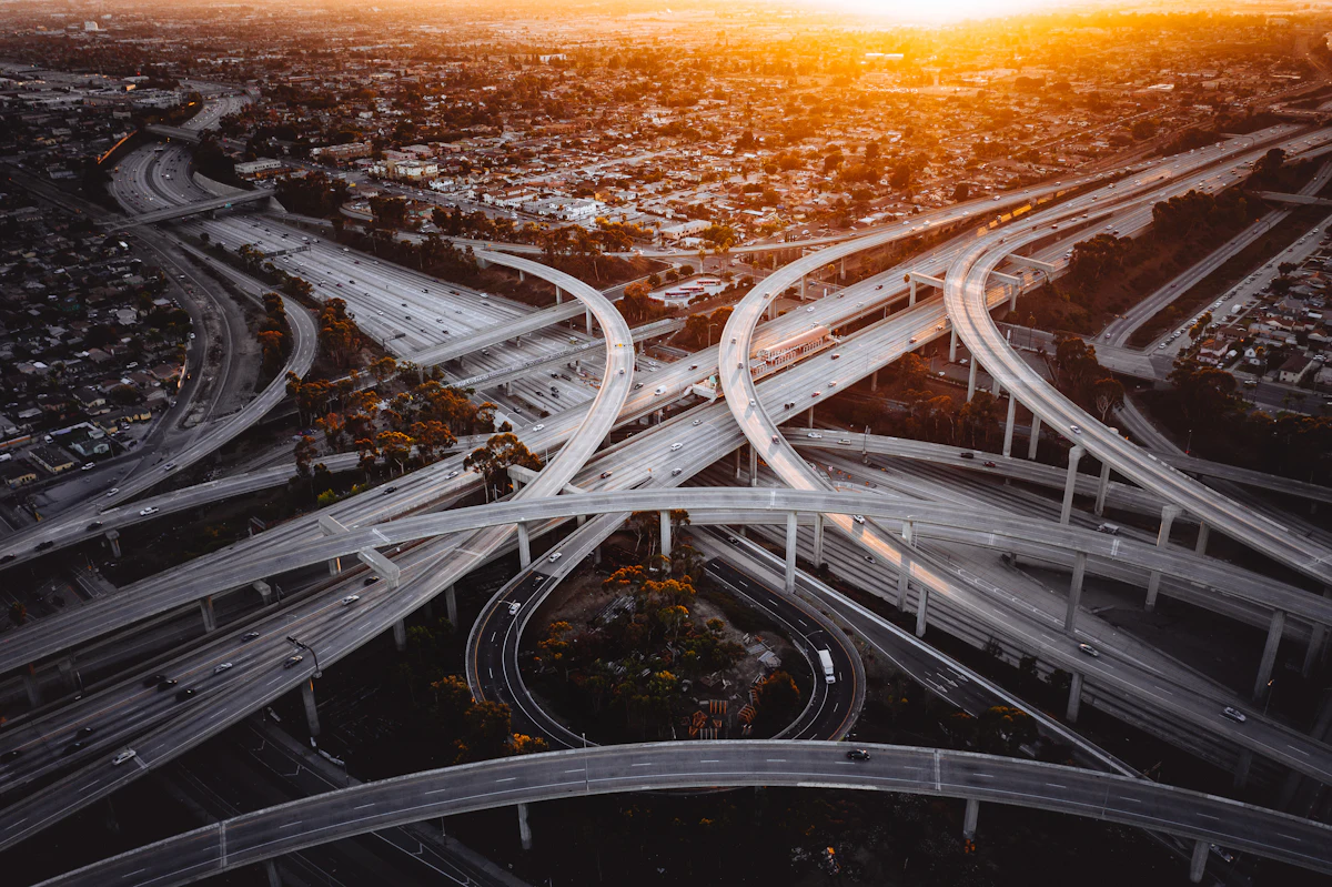 Aerial view of a major road interchange at sunset