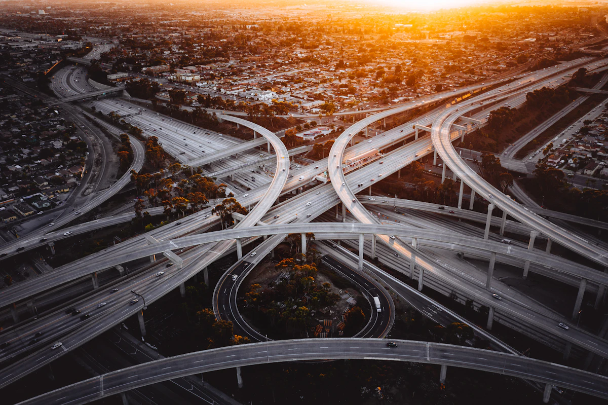 Aerial view of a highway interchange, representing MedBridge Transport's long-distance medical transport service