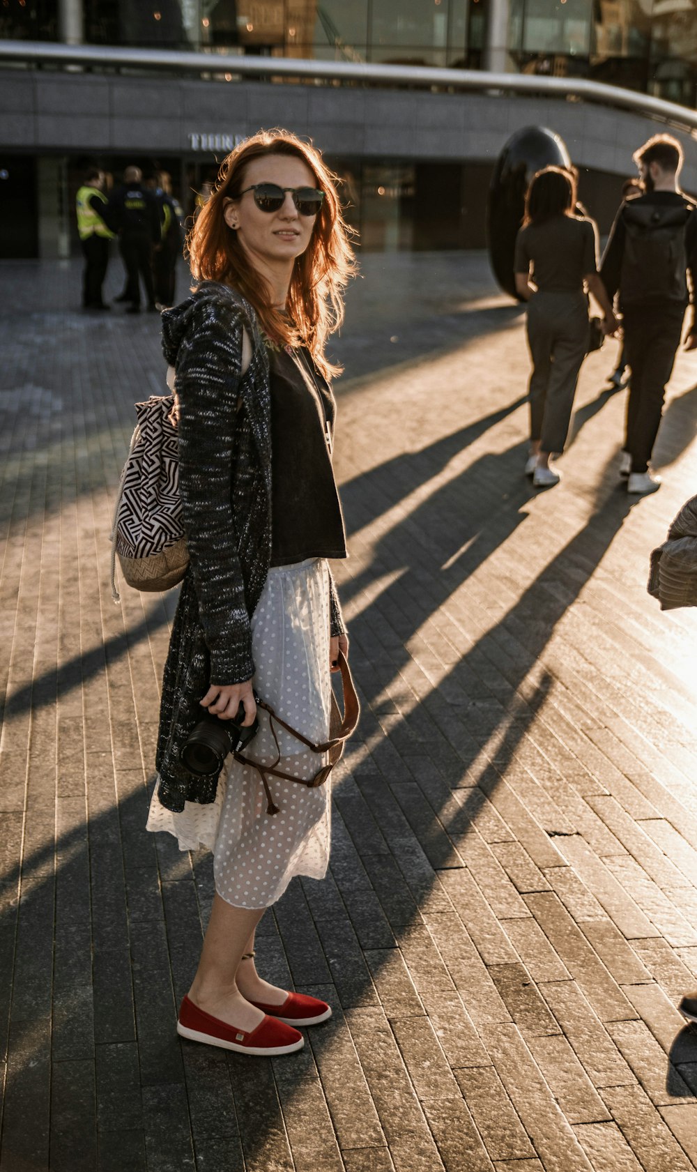 woman standing near building