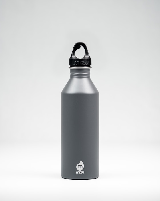 Stainless steel insulated water bottle on a neutral background