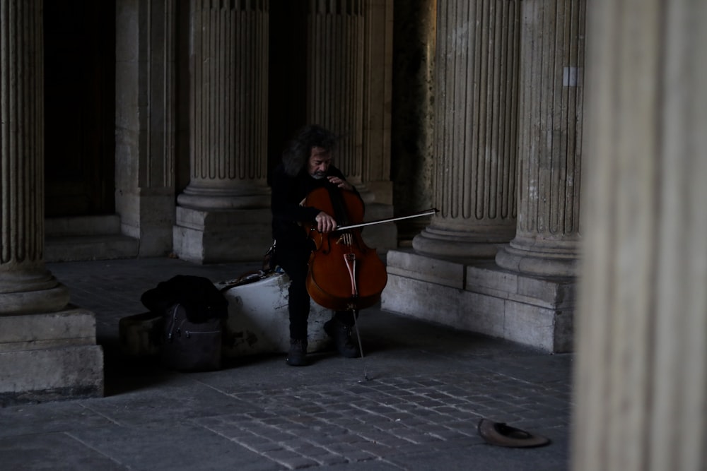 man playing bass instrument