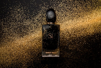 black glass perfume bottle showing front label