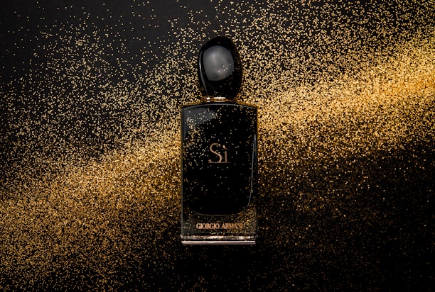 black glass perfume bottle showing front label