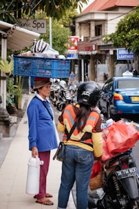 woman carrying blue basket on head