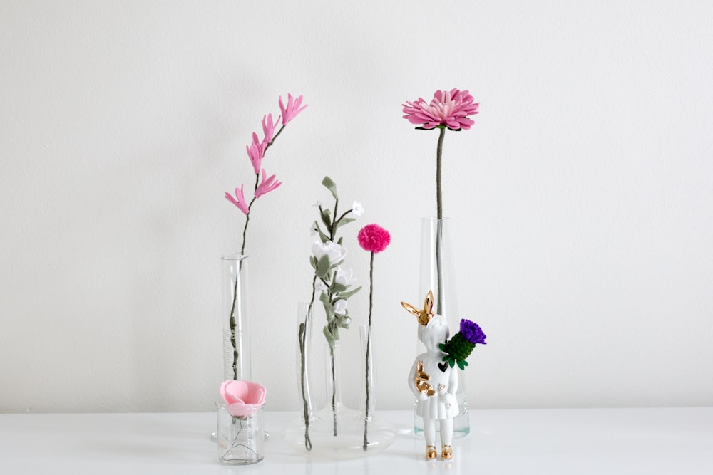 three pink flowers