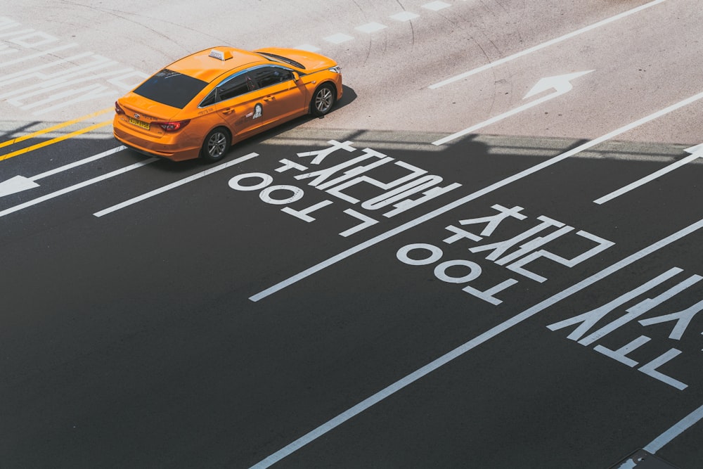 orange sedan with text overlay