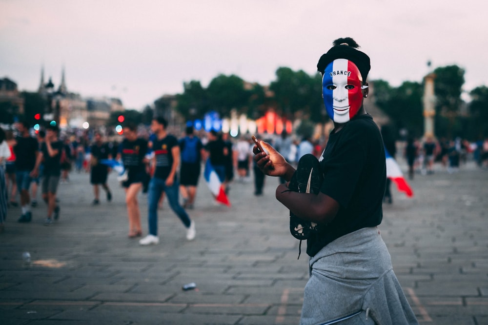 selective focus photography of person holding smartphone