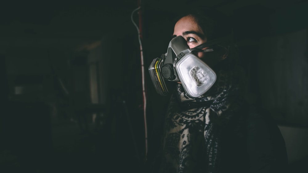 woman wearing black respirator