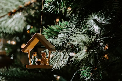 the nativity of christ-themed wooden christmas ornament manger google meet background