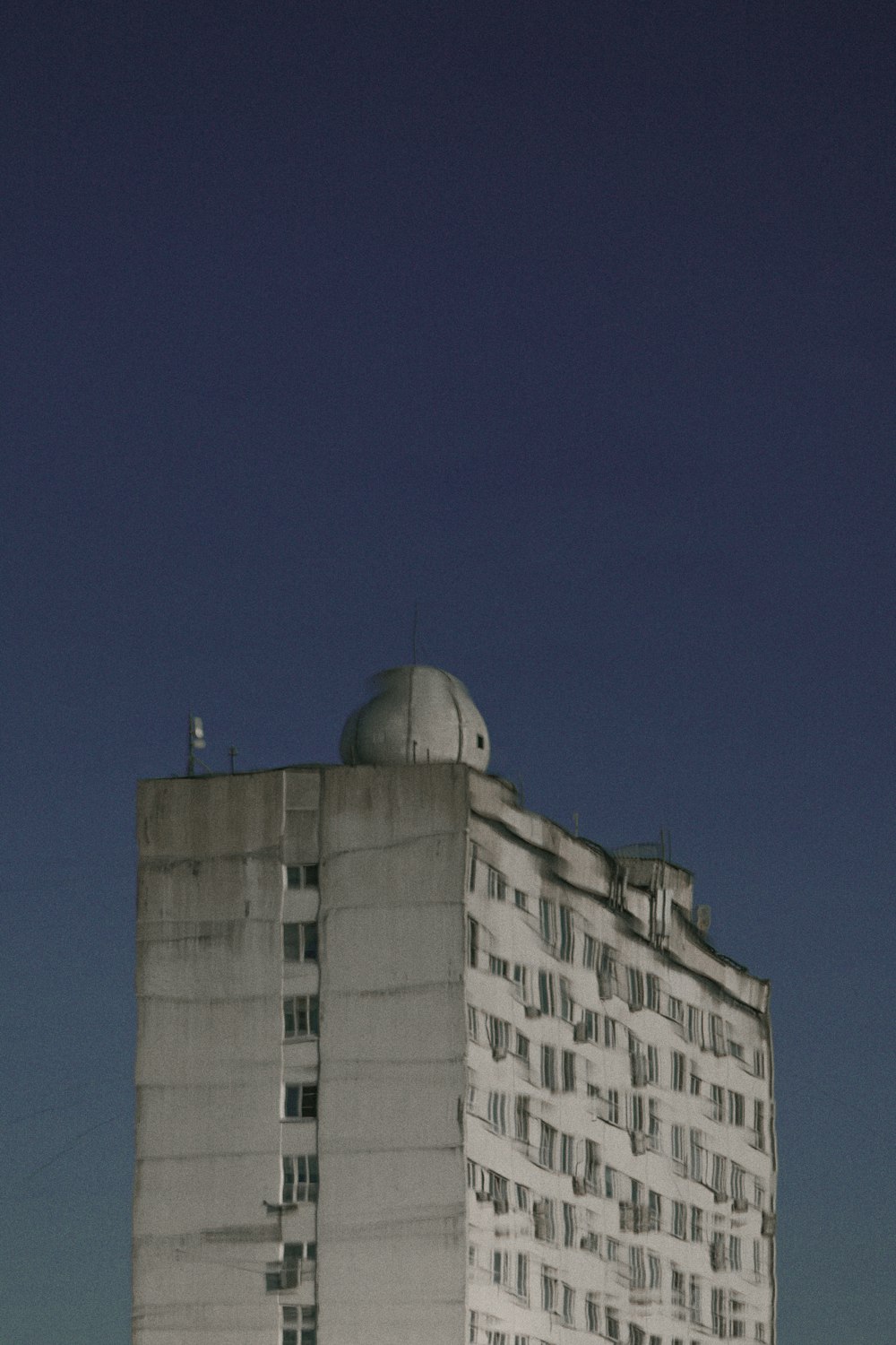 white multi-storey concrete building