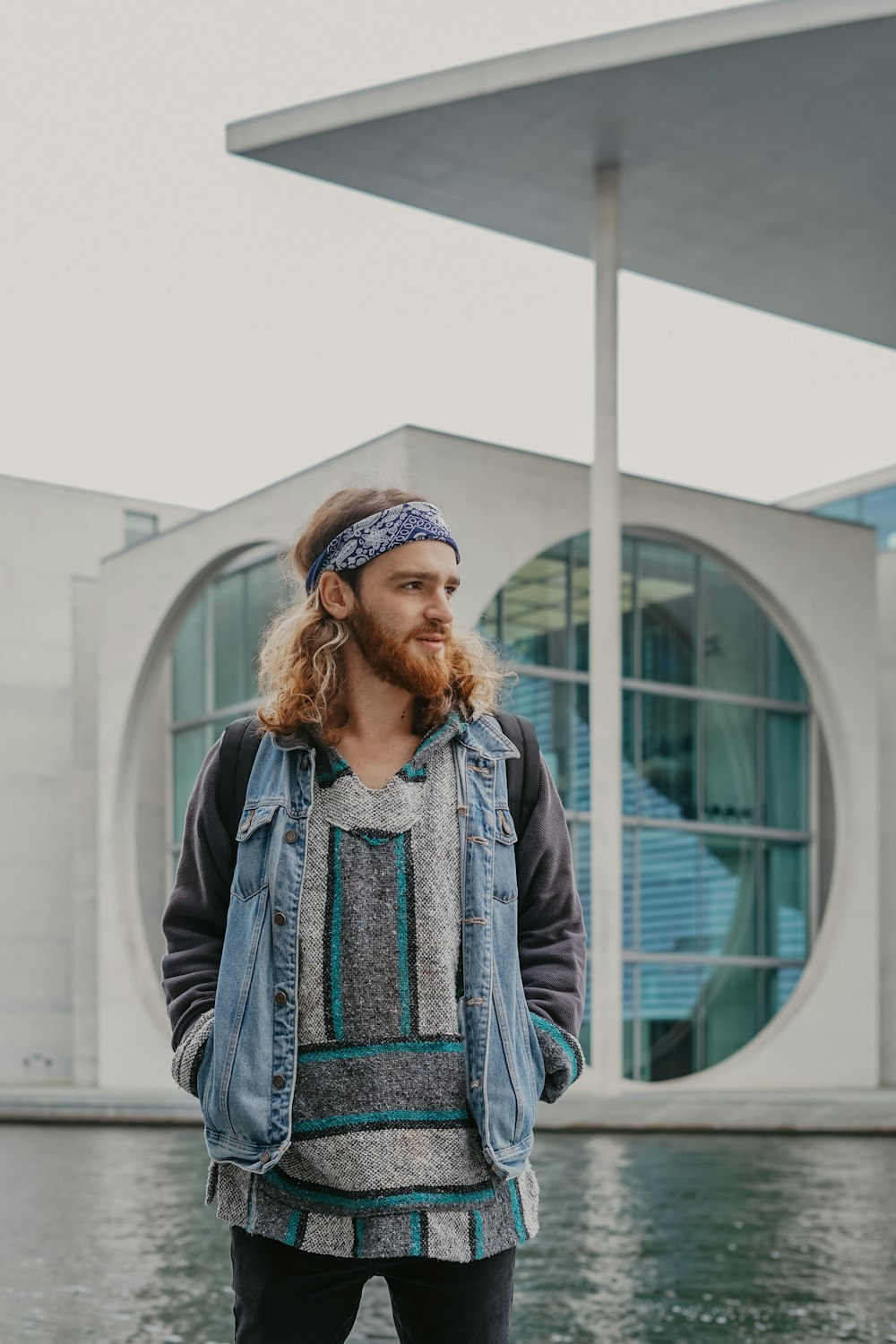 man wearing blue vest