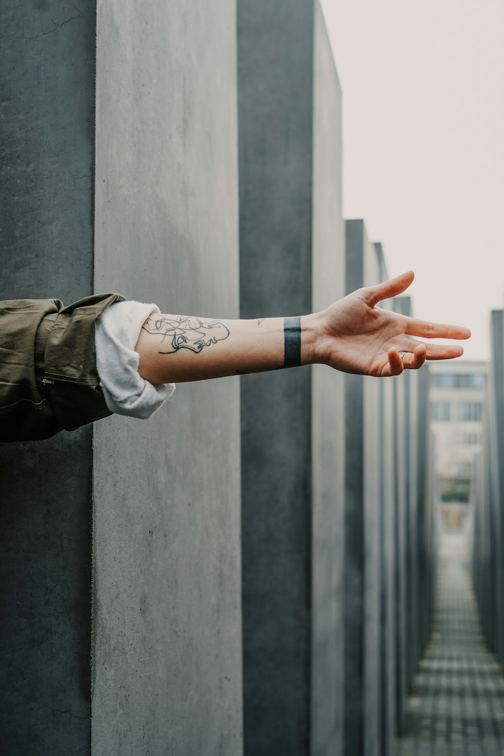 person showing arm tattoo