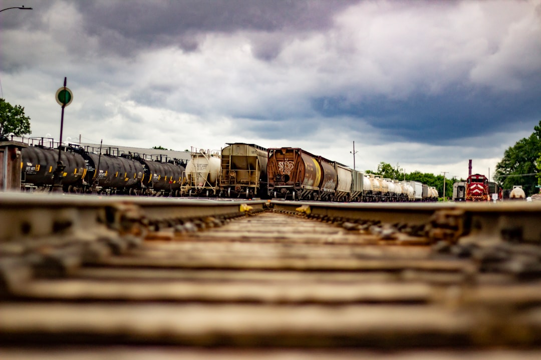 trains under cloudy sky