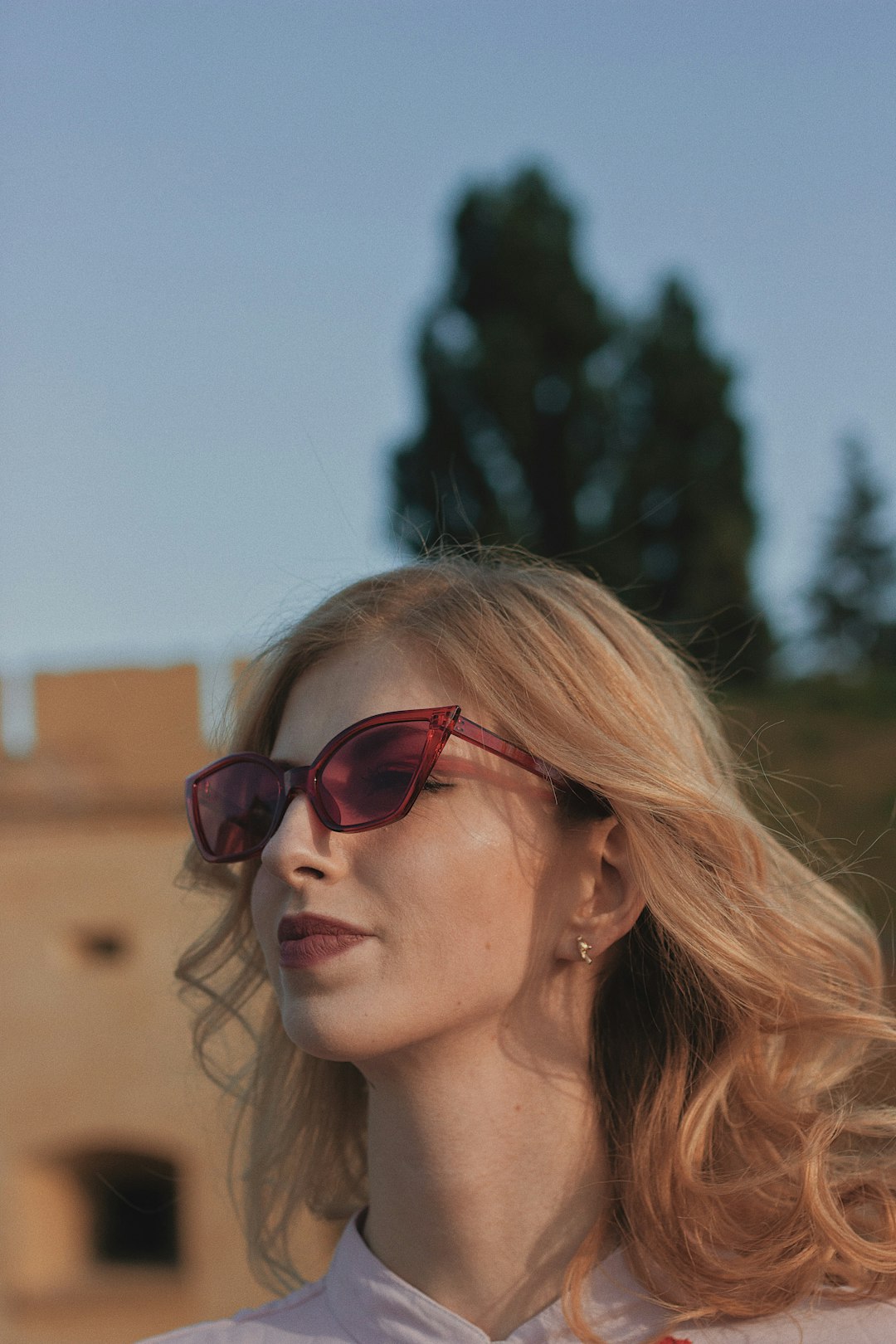 woman wearing red sunglasses