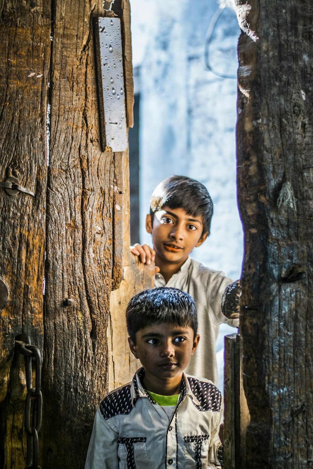 shallow focus photo of boy in white dress shirt