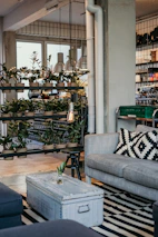 Modern industrial-style metal furniture arranged in a cozy living room setting.