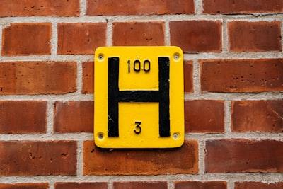 yellow and black number 6 wall decor