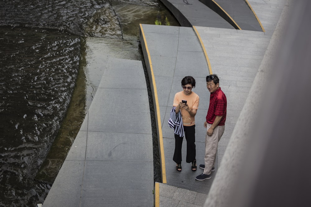 woman and man standing on stair