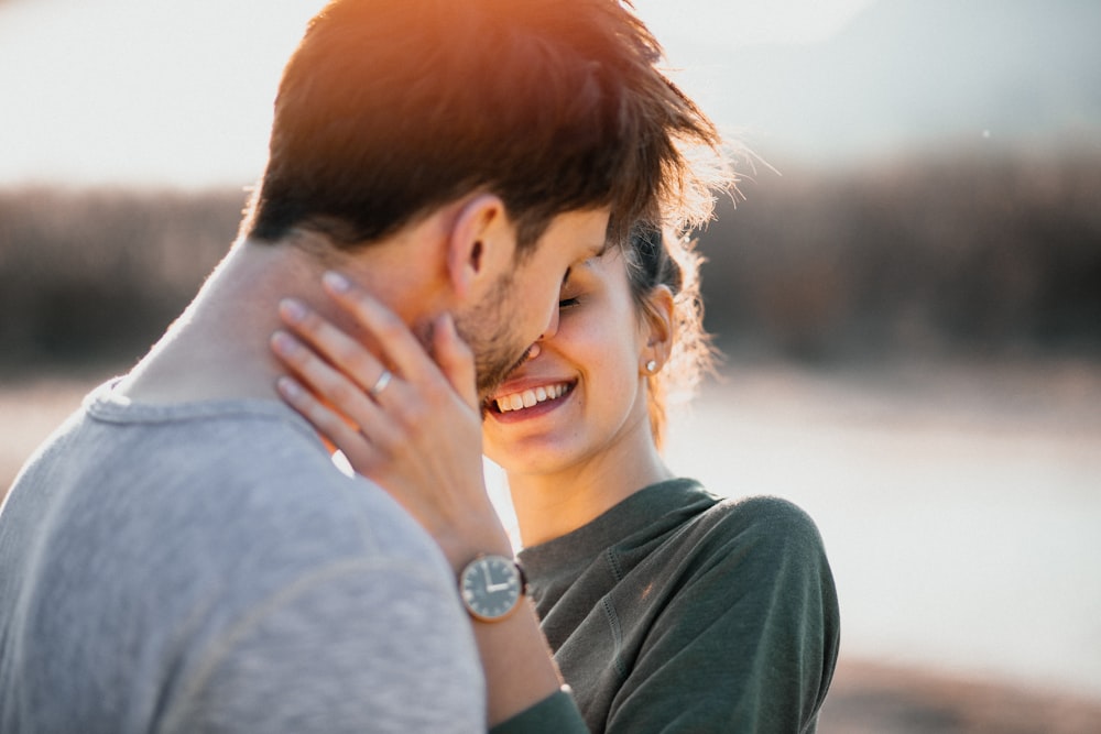 man and woman about to kiss outdoor