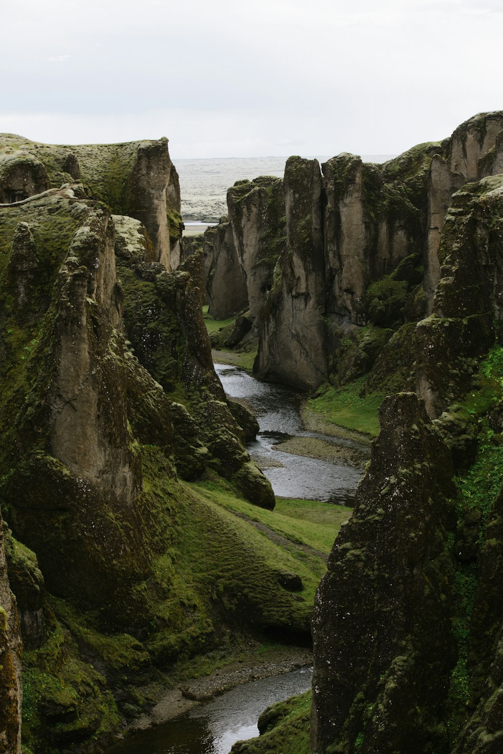 river in deep gorge between rock faced hills