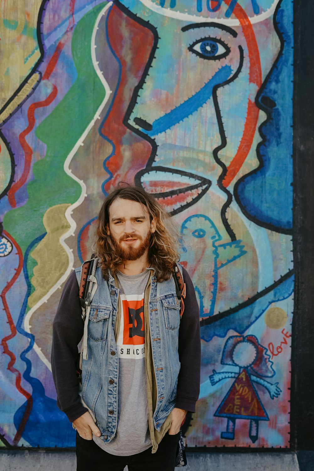 man wearing gray denim jacket