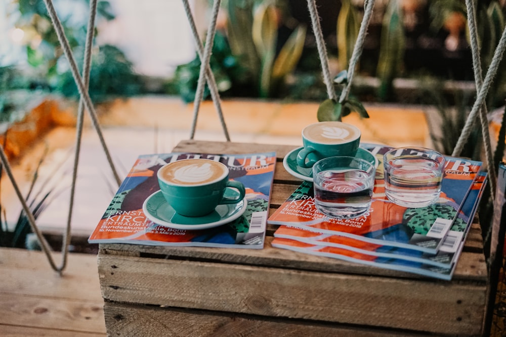 two blue ceramic coffee cups with coffee