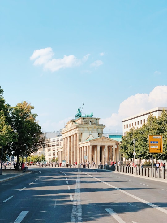 gray asphalt road across white building in Brandenburg Gate Germany