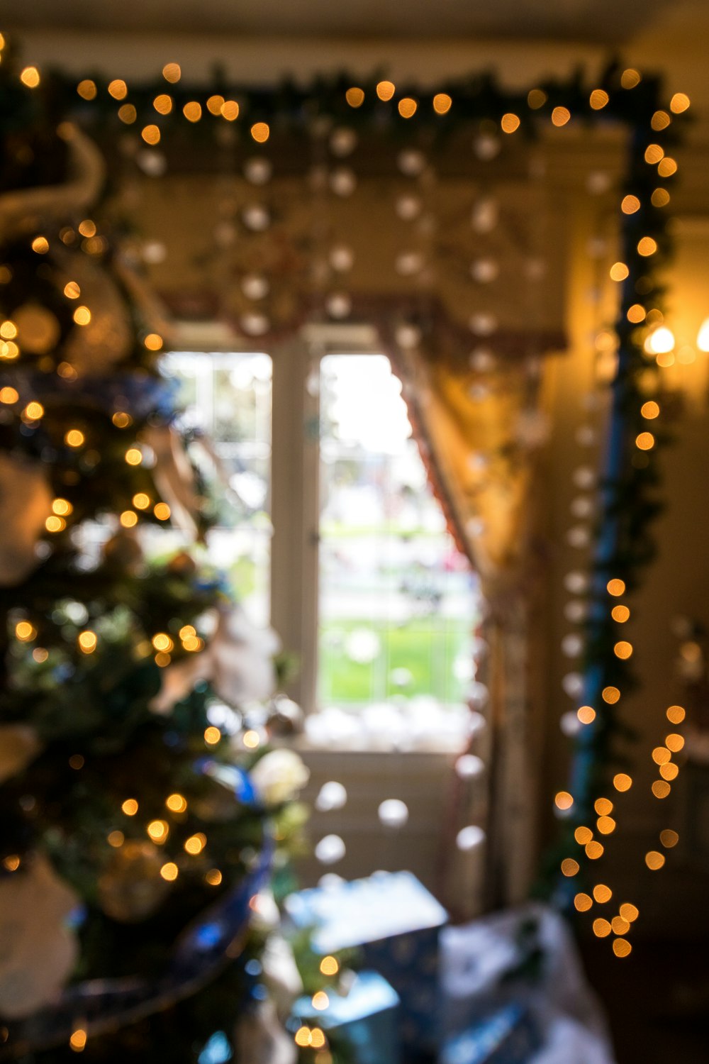 lighted Christmas tree near window