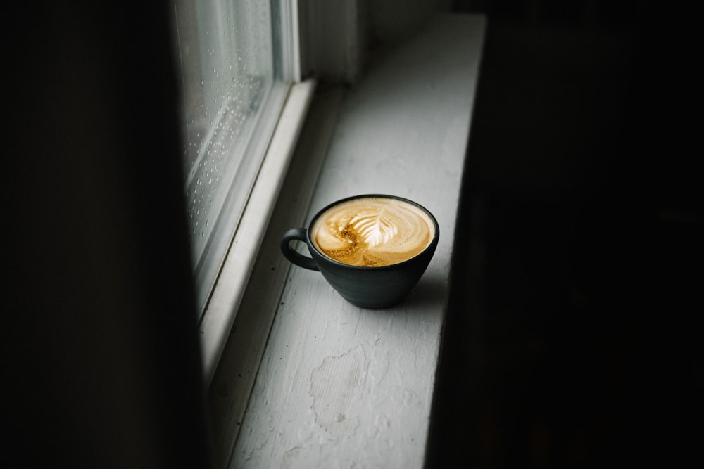 selective color photography of cappuccino cup