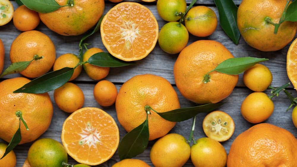 orange fruits on gray wooden surface