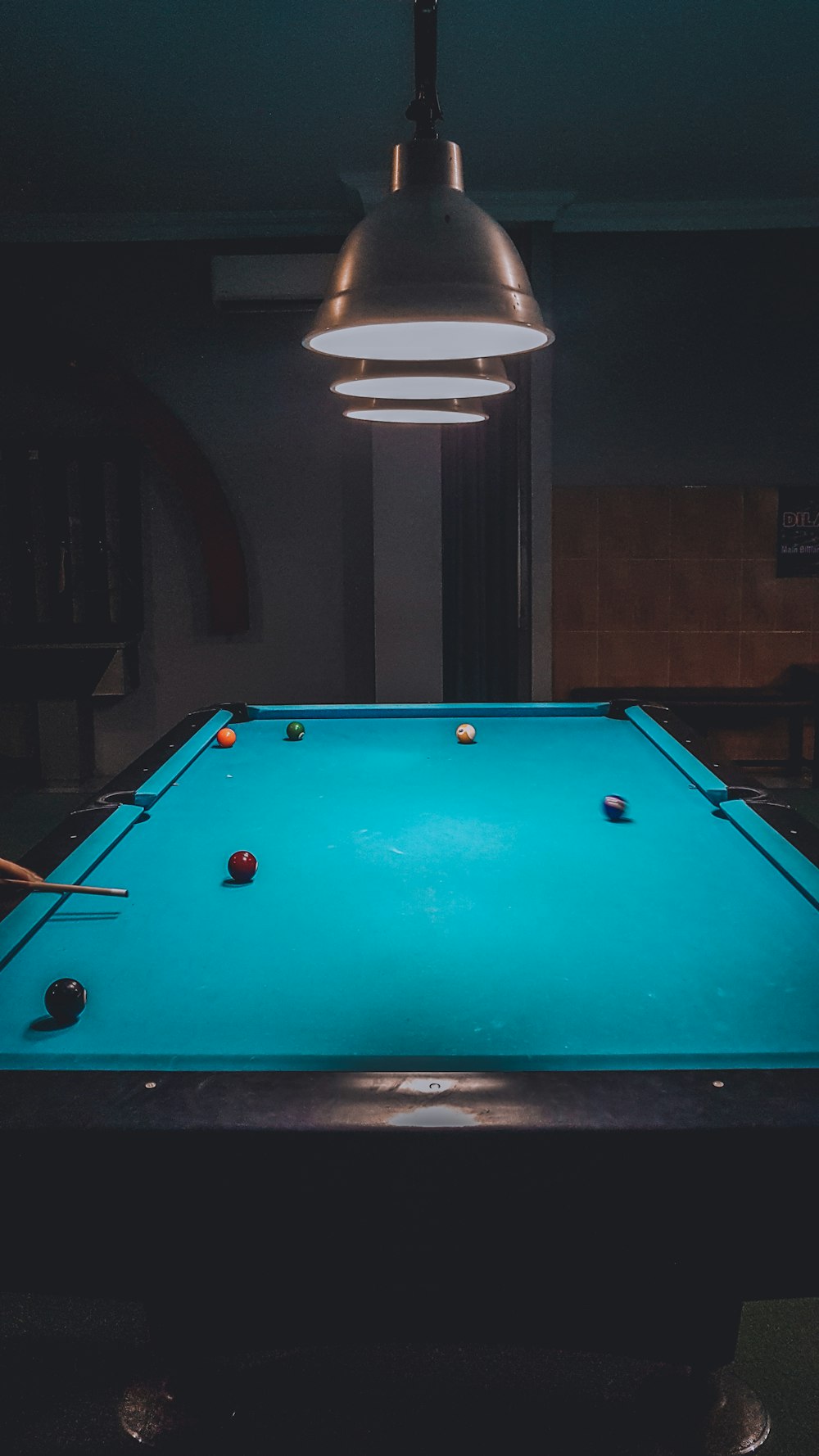 shallow focus photo of blue billiard table