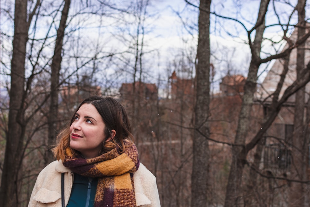 shallow focus photo of woman wearing brown scarf