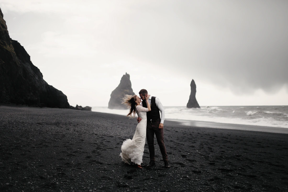 Newlyweds embracing on the beach
