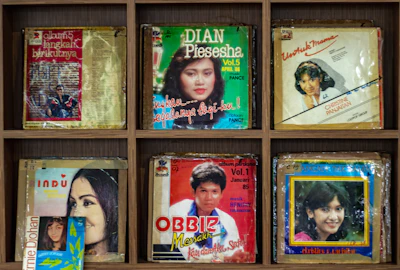 Close-up of vibrant album covers stacked in colorful arrangement