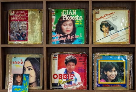 Close-up of a stylish Kpop album collection displayed on a sleek shelf.