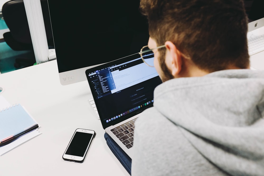 man using laptop computer