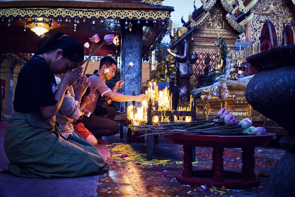 people offering candle