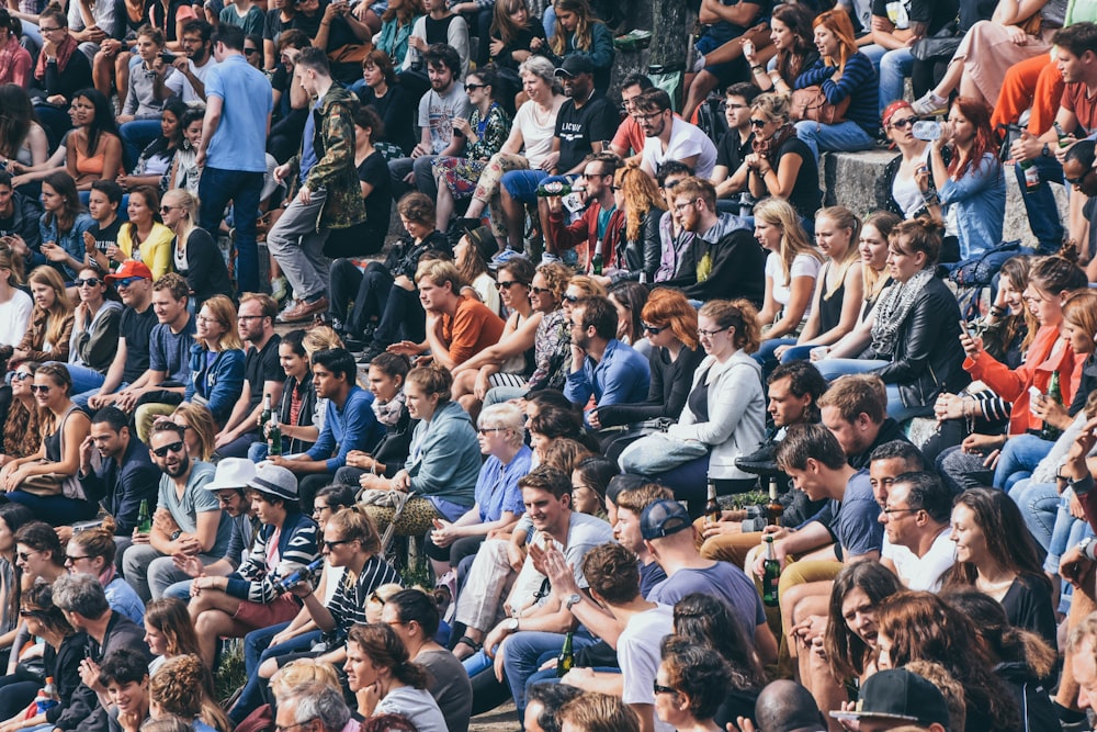 people sitting on stadium