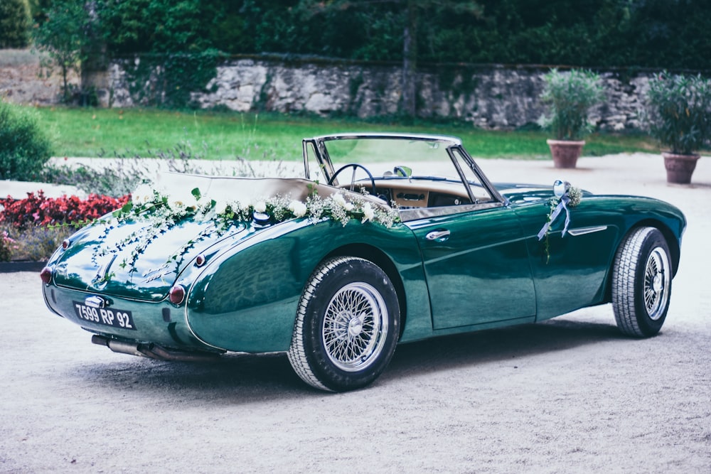 parked green coupe