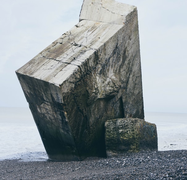 gray stone tablet on shore