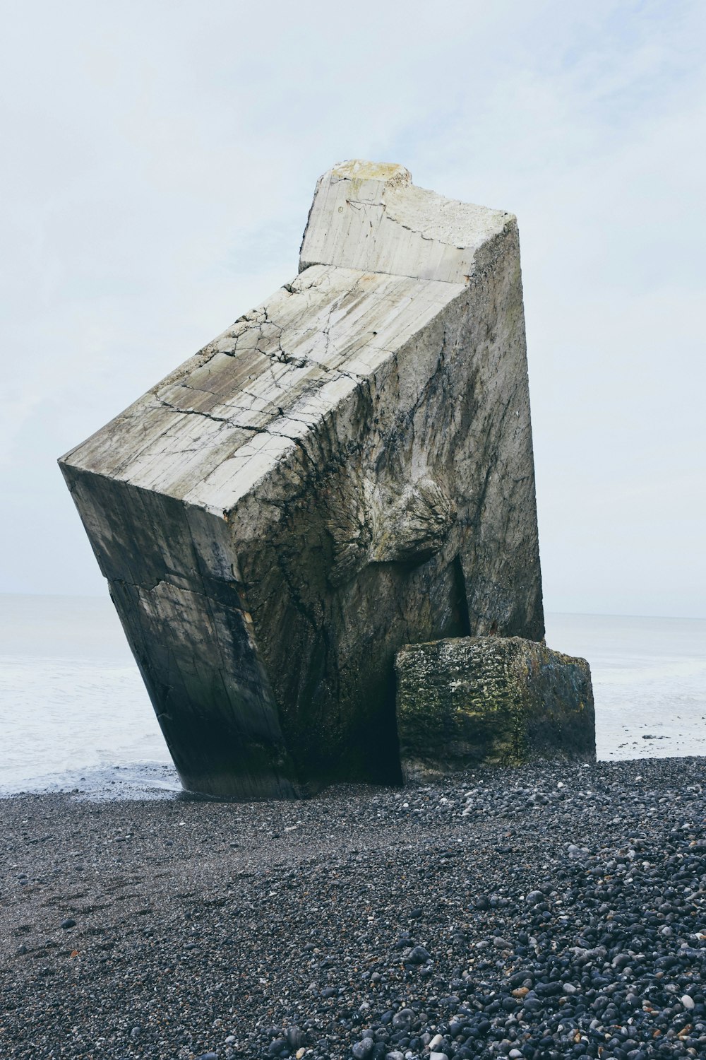 gray stone tablet on shore