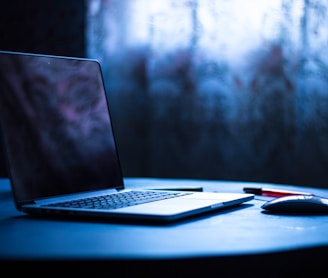 selective focus photography of laptop on table