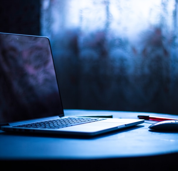 selective focus photography of laptop on table