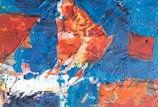 An abstract painting combining various bold colors and textures.